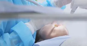 人工植牙專區 1 dentist-examining-woman-teeth-9R37TVT