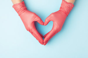 doctor hands in red gloves in shape of heart 2021 04 06 08 11 05 utc